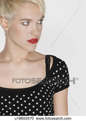Stock Image - Young woman looking away. Fotosearch
