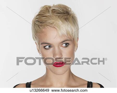 Young woman looking to side close-up View Large Photo Image Stock Photo - Young woman looking to side close-up. Fotosearch