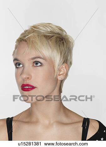 Young woman looking up close-up View Large Photo Image Stock Image - Young woman looking up close-up. Fotosearch