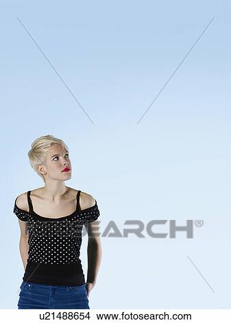 Young woman looking up View Large Photo Image Picture - Young woman looking up. Fotosearch