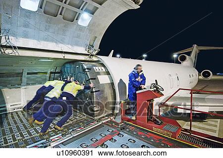 Stock Image - Airfreight loading onto Boeing 727. Fotosearch