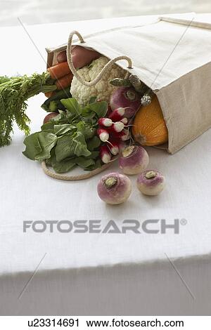 Bag full of fresh vegetables on table close-up View Large Photo Image Stock Image - Bag full of fresh vegetables on table close-up. Fotosearch