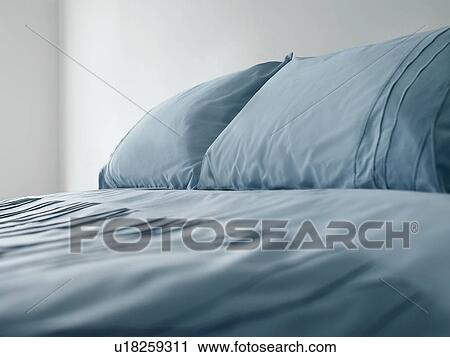 Bed with blue linen View Large Photo Image Stock Image - Bed with blue linen. Fotosearch