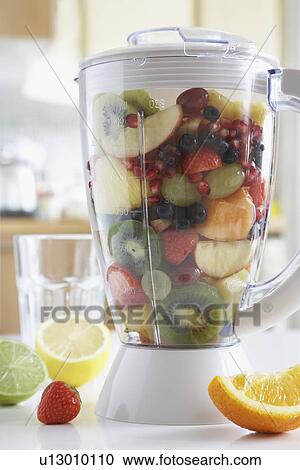 Blender filled with fresh fruits close-up View Large Photo Image Stock Image - Blender filled with fresh fruits close-up. Fotosearch
