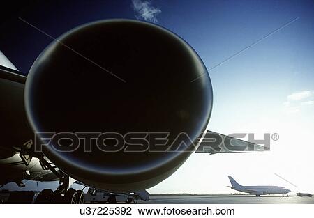 Boeing 767 jet aircrat engine foreground Boeing 737 in background. View Large Photo Image Stock Image - Boeing 767 jet aircrat engine foreground Boeing 737 in background.. Fotosearch