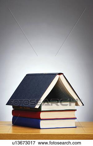 Books arranged in shape of house studio shot View Large Photo Image Stock Photo - Books arranged in shape of house studio shot. Fotosearch