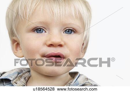 Boy (3-4) against white background View Large Photo Image Stock Photo - Boy (3-4) against white background. Fotosearch