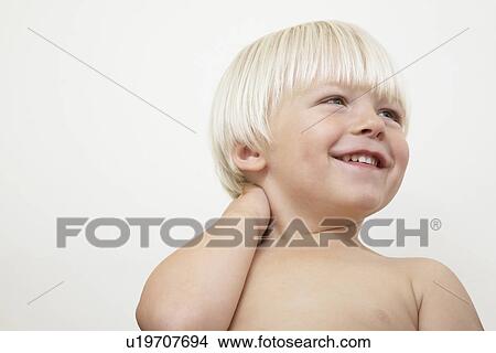 Boy (3-4) laughing against white background View Large Photo Image Picture - Boy (3-4) laughing against white background. Fotosearch