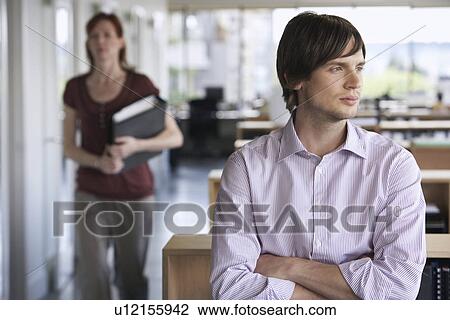 Business man and colleague in office View Large Photo Image Stock Image - Business man and colleague in office. Fotosearch