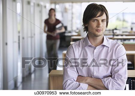 Stock Image - Business man in office portrait. Fotosearch