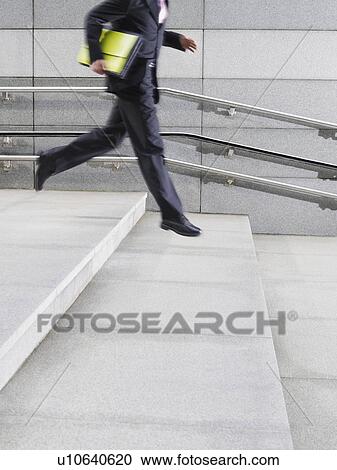 Business man running down steps outdoors side view low section View Large Photo Image Stock Image - Business man running down steps outdoors side view low section. Fotosearch
