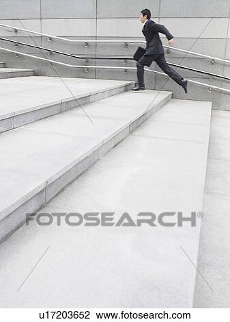 Business man running up steps outdoors side view View Large Photo Image Stock Image - Business man running up steps outdoors side view. Fotosearch