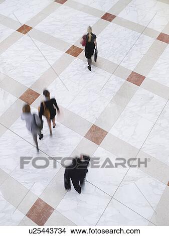Business people walking elevated view long exposure View Large Photo Image Picture - Business people walking elevated view long exposure. Fotosearch