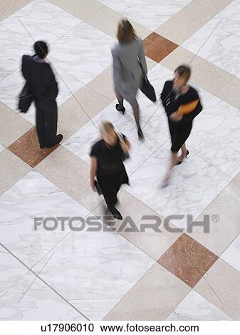 Business people walking elevated view long exposure View Large Photo Image Stock Image - Business people walking elevated view long exposure. Fotosearch
