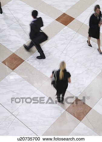 Business people walking elevated view long exposure View Large Photo Image Stock Image - Business people walking elevated view long exposure. Fotosearch