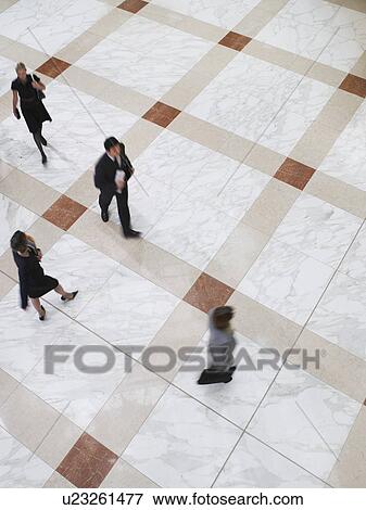 Business people walking elevated view long exposure View Large Photo Image Stock Photo - Business people walking elevated view long exposure. Fotosearch