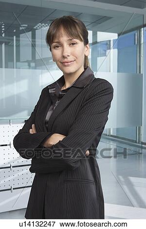 Business woman in office building smiling portrait View Large Photo Image Stock Photo - Business woman in office building smiling portrait. Fotosearch