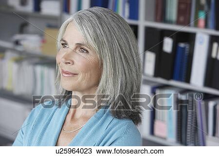 Business woman in office elevated view View Large Photo Image Stock Image - Business woman in office elevated view. Fotosearch
