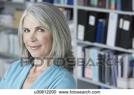 Business woman in office elevated view portrait View Large Photo Image Stock Image - Business woman in office elevated view portrait. Fotosearch