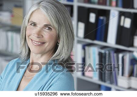 Business woman in office elevated view portrait View Large Photo Image Stock Photograph - Business woman in office elevated view portrait. Fotosearch