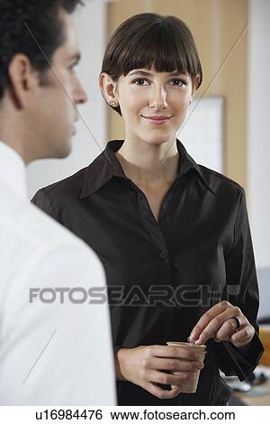 Business woman with drink beside colleague portrait View Large Photo Image Stock Photograph - Business woman with drink beside colleague portrait. Fotosearch