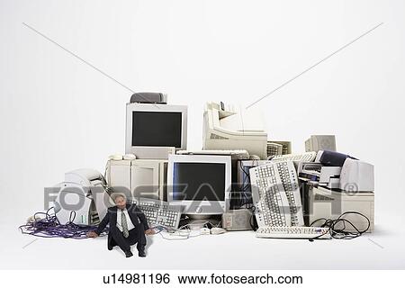 Businessman Next to Old Computers View Large Photo Image Stock Photograph - Businessman Next to Old Computers. Fotosearch