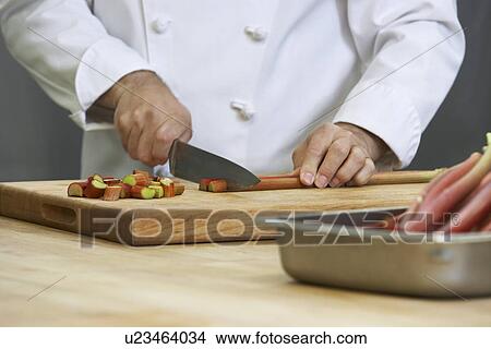 Chef chopping rhubarb close-up View Large Photo Image Picture - Chef chopping rhubarb close-up. Fotosearch
