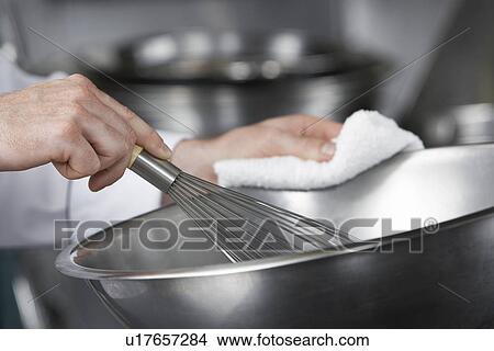 Chef mixing ingredients in bowl close-up View Large Photo Image Picture - Chef mixing ingredients in bowl close-up. Fotosearch
