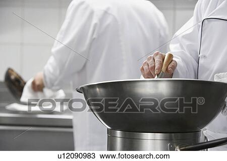 Chef mixing ingredients in bowl close-up View Large Photo Image Stock Image - Chef mixing ingredients in bowl close-up. Fotosearch
