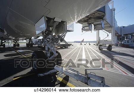 Close-up of airplanes wheel at airport View Large Photo Image Picture - Close-up of airplanes wheel at airport. Fotosearch