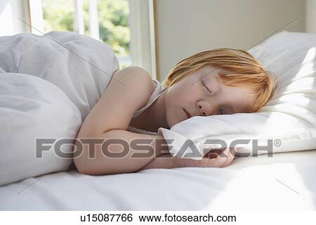 Close-up of girl (5-6) sleeping in bed View Large Photo Image Stock Photograph - Close-up of girl (5-6) sleeping in bed. Fotosearch