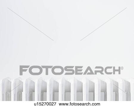 Close up of radiator against white wall View Large Photo Image Stock Photo - Close up of radiator against white wall. Fotosearch