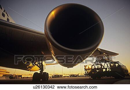 Close-up on jet engine at sunset View Large Photo Image Stock Image - Close-up on jet engine at sunset. Fotosearch