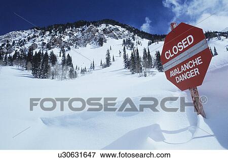 Stock Photo - Closed--avalanche danger' sign in snow. Fotosearch
