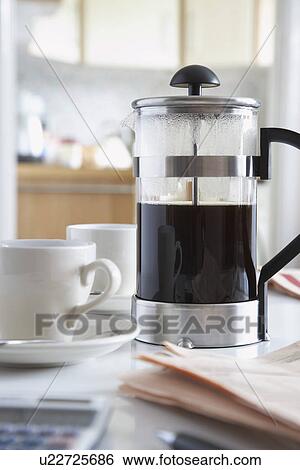 Coffee in cafeteria and coffee cups close-up View Large Photo Image Stock Photograph - Coffee in cafeteria and coffee cups close-up. Fotosearch