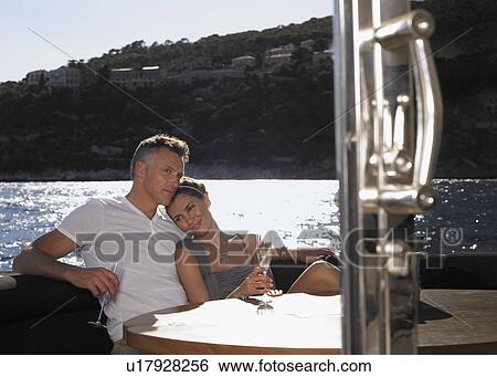 Couple Drinking Champagne on Boat View Large Photo Image Stock Photograph - Couple Drinking Champagne on Boat. Fotosearch