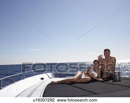 Couple Drinking Champaign on Boat View Large Photo Image Stock Image - Couple Drinking Champaign on Boat. Fotosearch