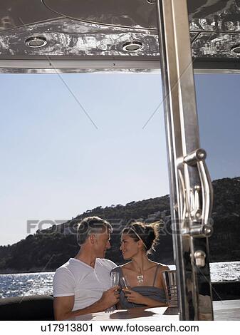 Couple Drinking Champaign on Boat View Large Photo Image Stock Image - Couple Drinking Champaign on Boat. Fotosearch