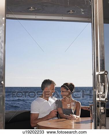 Couple Drinking Champaign on Boat View Large Photo Image Stock Image - Couple Drinking Champaign on Boat. Fotosearch