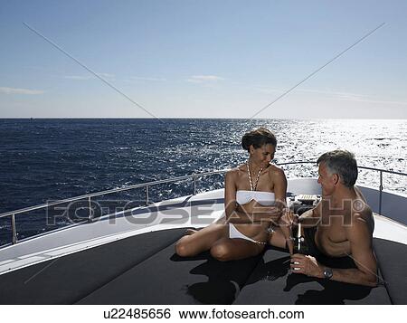 Couple Drinking Champaign on Boat View Large Photo Image Stock Photograph - Couple Drinking Champaign on Boat. Fotosearch