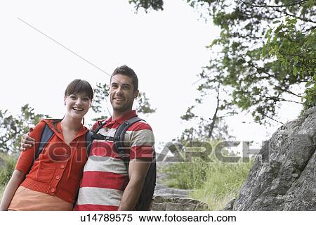Stock Photography - Couple embracing in countryside portrait. Fotosearch