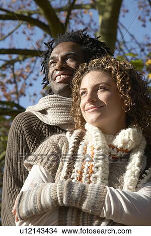 Couple embracing outdoors View Large Photo Image Picture - Couple embracing outdoors. Fotosearch
