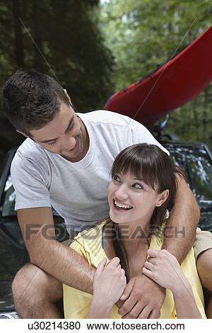 Couple embracing outdoors View Large Photo Image Stock Image - Couple embracing outdoors. Fotosearch