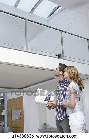 Couple observing new home View Large Photo Image Stock Photography - Couple observing new home. Fotosearch