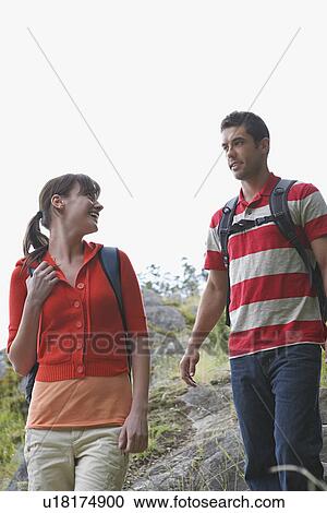 Couple walking in countryside View Large Photo Image Stock Image - Couple walking in countryside. Fotosearch