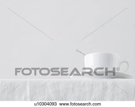 Cup of tea on table low angle view studio shot View Large Photo Image Stock Image - Cup of tea on table low angle view studio shot. Fotosearch