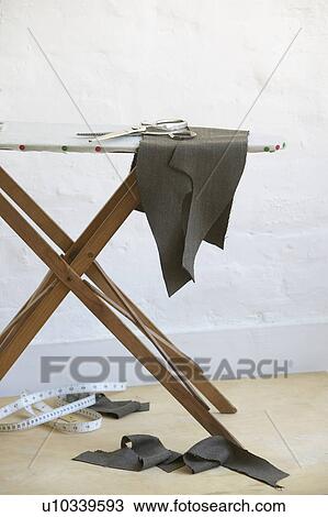 Cut pieces of fabric on ironing board View Large Photo Image Stock Image - Cut pieces of fabric on ironing board. Fotosearch