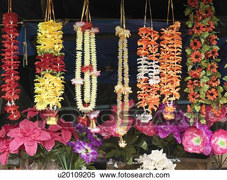Stock Photography - Different necklaces and artificial flowers. Fotosearch