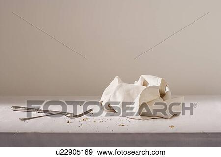 Dish cloth cutlery and crumbs on table View Large Photo Image Stock Photo - Dish cloth cutlery and crumbs on table. Fotosearch