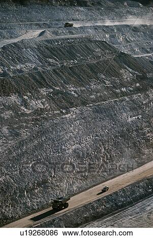 Earth moving trucks open cut gold mine Telfer Western Australia View Large Photo Image Stock Photograph - Earth moving trucks open cut gold mine Telfer Western Australia. Fotosearch